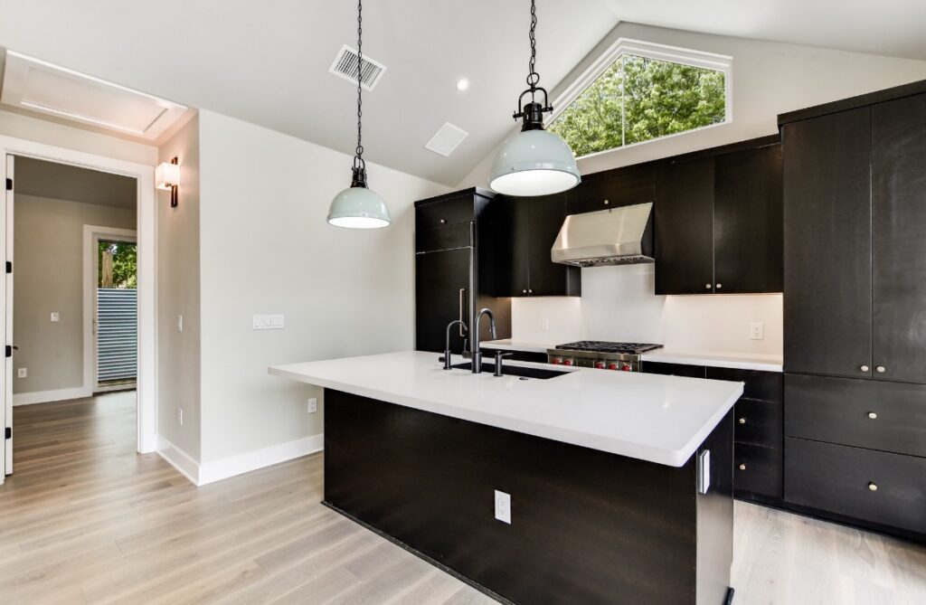 Modern kitchen with island in Austin ADU construction project