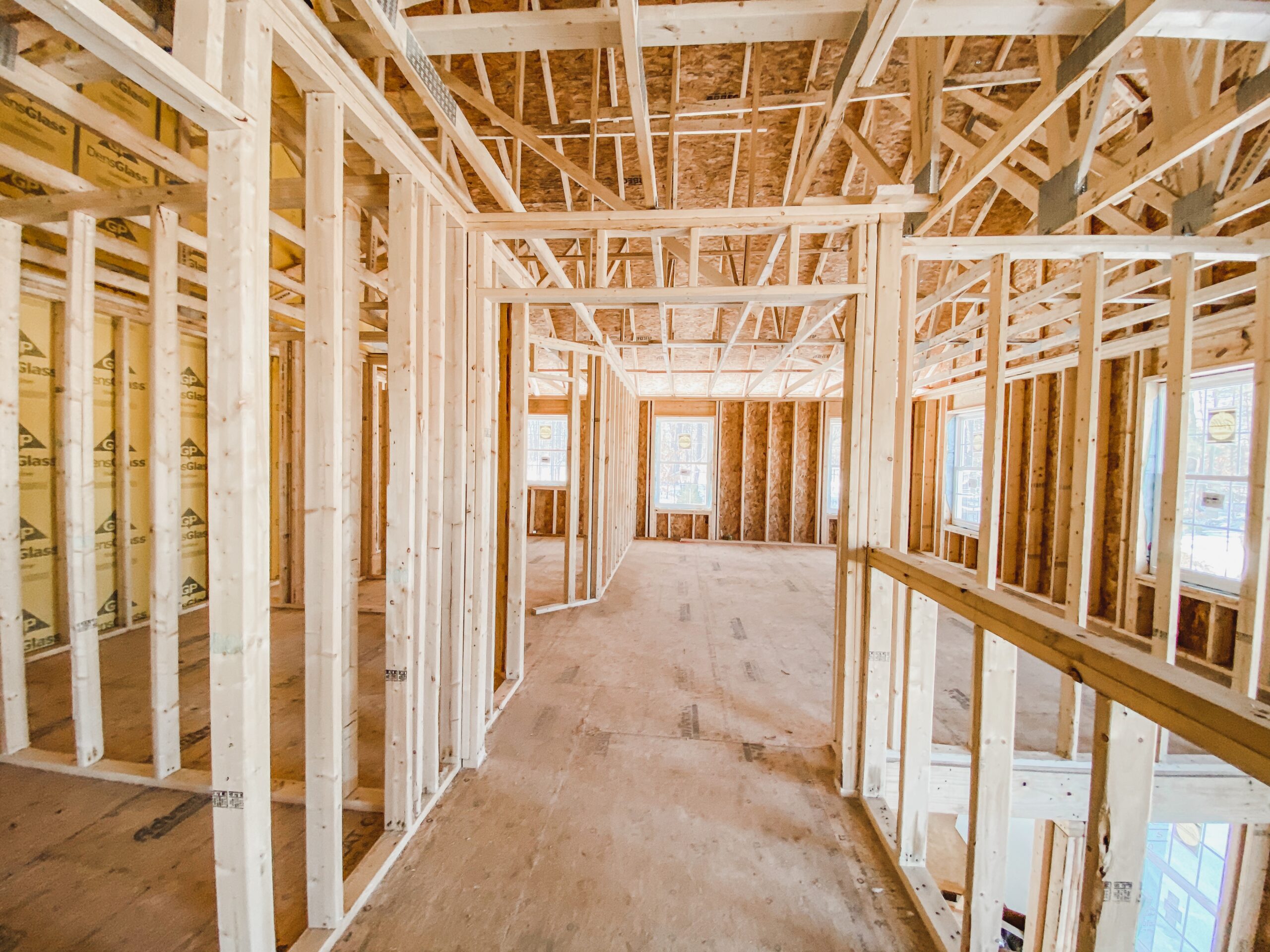 Interior framing and structural layout of luxury custom home under construction in Austin, Texas