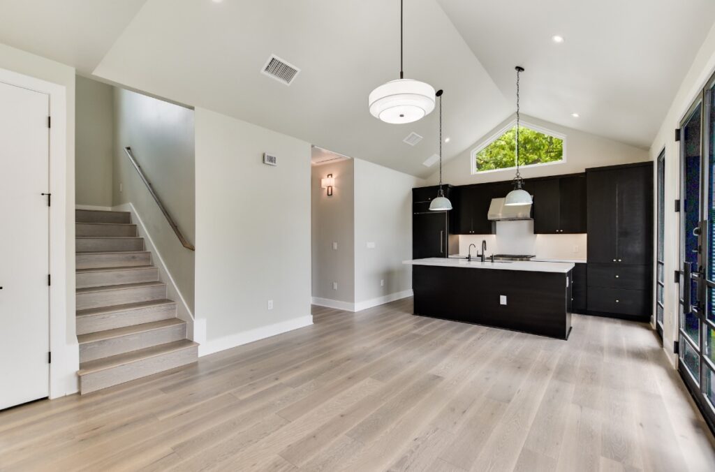 Modern ADU interior with staircase and kitchen in Austin, TX