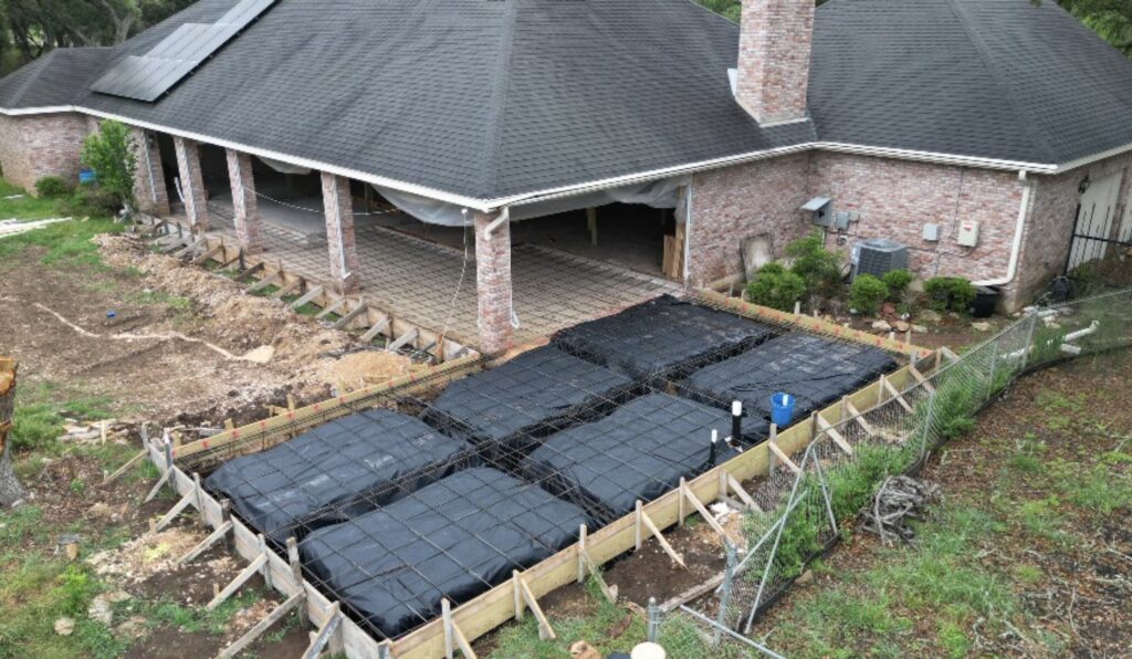 Outdoor living area foundation preparation and concrete formwork construction project