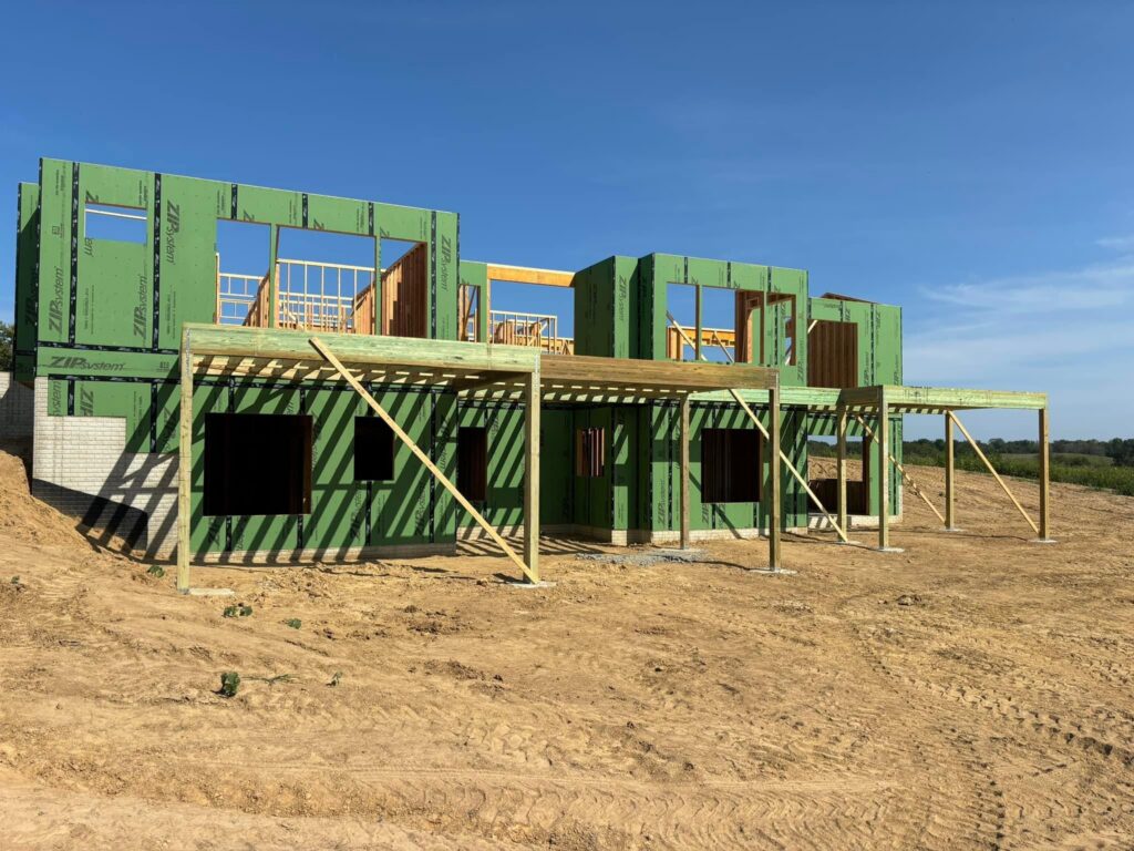 Second-story outdoor living area and deck framing for luxury custom residence